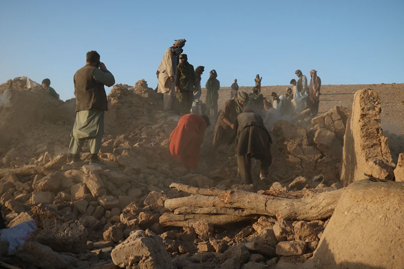 Afghan residents clear debris from a damaged house after earthquake in Sarbuland village of Zendeh Jan district of Herat province on October 7,2023 (Photo by Mohsen KARIMI / AFP) (Photo by MOHSEN KARIMI/AFP via Getty Images)