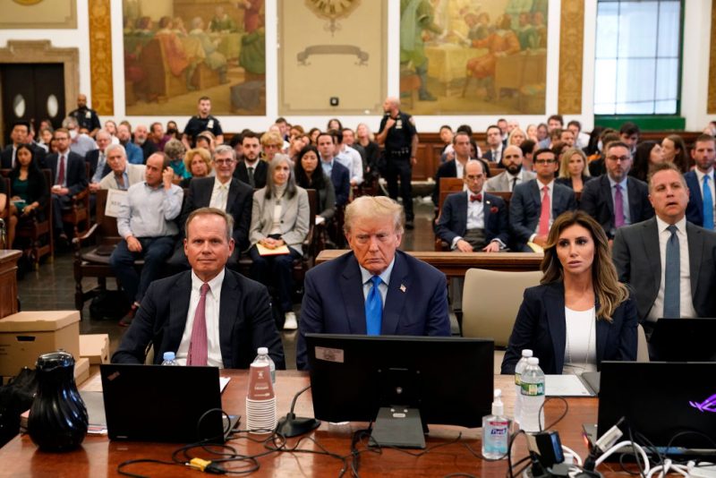 NEW YORK, NEW YORK - OCTOBER 02: Former U.S. President Donald Trump (C) attends the start of his civil fraud trial at New York State Supreme Court on October 02, 2023 in New York City. Former President Trump may be forced to sell off his properties after Justice Arthur Engoron canceled his business certificates and ruled that he committed fraud for years while building his real estate empire after being sued by Attorney General Letitia James, who is seeking $250 million in damages. The trial will determine how much he and his companies will be penalized for the fraud. (Photo by Seth Wenig-Pool/Getty Images)
