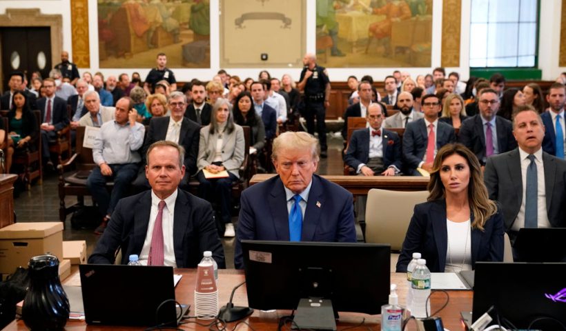 NEW YORK, NEW YORK - OCTOBER 02: Former U.S. President Donald Trump (C) attends the start of his civil fraud trial at New York State Supreme Court on October 02, 2023 in New York City. Former President Trump may be forced to sell off his properties after Justice Arthur Engoron canceled his business certificates and ruled that he committed fraud for years while building his real estate empire after being sued by Attorney General Letitia James, who is seeking $250 million in damages. The trial will determine how much he and his companies will be penalized for the fraud. (Photo by Seth Wenig-Pool/Getty Images)