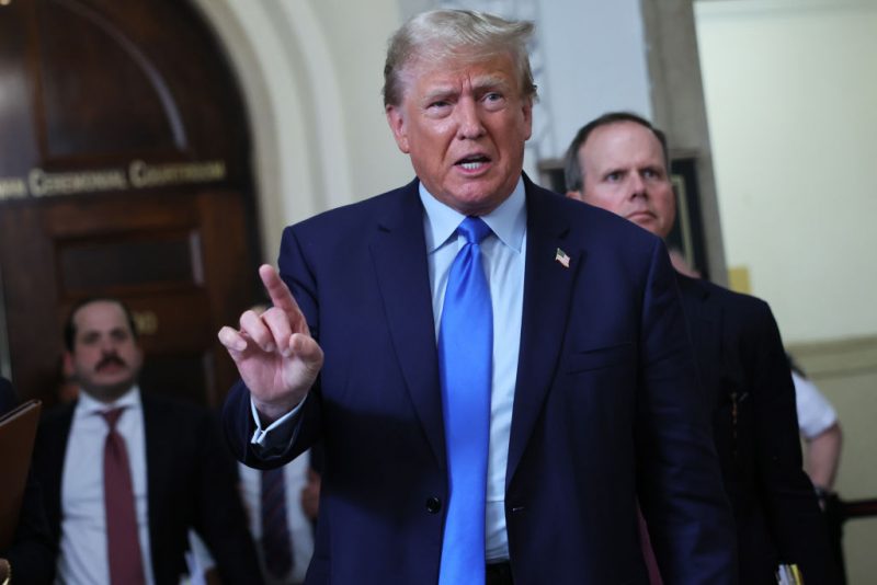 NEW YORK, NEW YORK - OCTOBER 02: Former U.S. President Donald Trump speaks to the media after exiting the courtroom for a lunch recess during the first day of his civil fraud trial at New York State Supreme Court on October 02, 2023 in New York City. Former President Trump may be forced to sell off his properties after Justice Arthur Engoron canceled his business certificates and ruled that he committed fraud for years while building his real estate empire after being sued by Attorney General Letitia James, who is seeking $250 million in damages. The trial will determine how much he and his companies will be penalized for the fraud. (Photo by Michael M. Santiago/Getty Images)