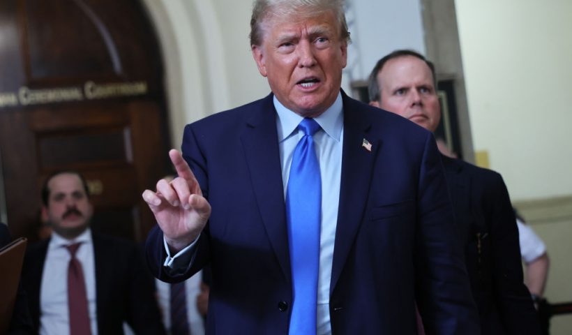 NEW YORK, NEW YORK - OCTOBER 02: Former U.S. President Donald Trump speaks to the media after exiting the courtroom for a lunch recess during the first day of his civil fraud trial at New York State Supreme Court on October 02, 2023 in New York City. Former President Trump may be forced to sell off his properties after Justice Arthur Engoron canceled his business certificates and ruled that he committed fraud for years while building his real estate empire after being sued by Attorney General Letitia James, who is seeking $250 million in damages. The trial will determine how much he and his companies will be penalized for the fraud. (Photo by Michael M. Santiago/Getty Images)