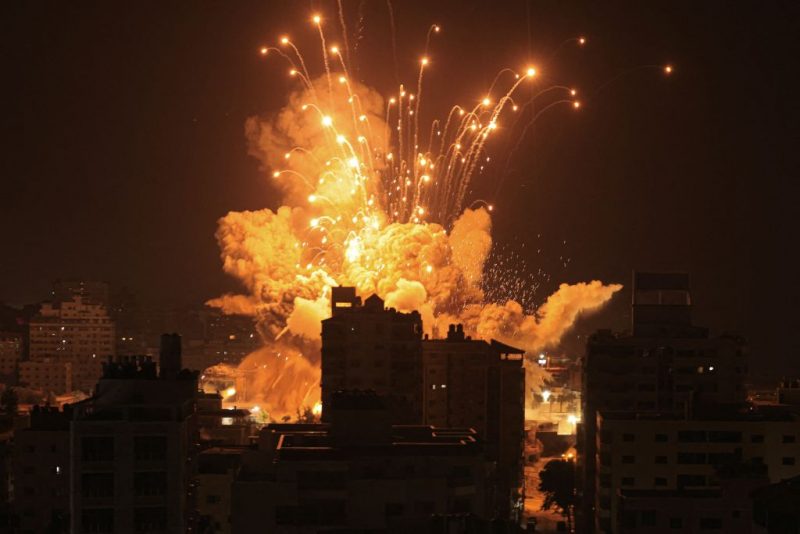 TOPSHOT - A missile explodes in Gaza City during an Israeli air strike on October 8, 2023. srael, reeling from the deadliest attack on its territory in half a century, formally declared war on Hamas Sunday as the conflict's death toll surged close to 1,000 after the Palestinian militant group launched a massive surprise assault from Gaza. (Photo by MAHMUD HAMS / AFP) (Photo by MAHMUD HAMS/AFP via Getty Images)