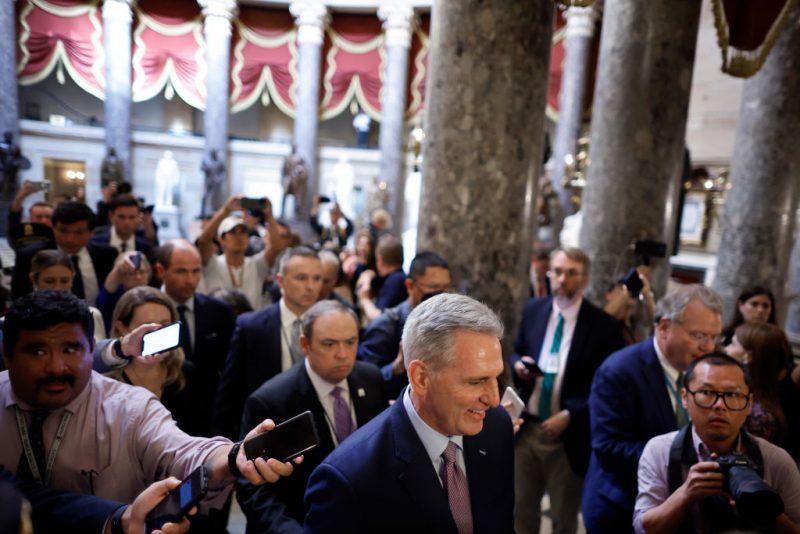 WASHINGTON, DC - OCTOBER 03: Speaker of the House Kevin McCarthy (R-CA) is surrounded by staff, security and journalists as he walks to the House Chamber ahead of a vote at the U.S. Capitol on October 03, 2023 in Washington, DC. McCarthy's speakership is being challenged by a handful of conservative members of his own party lead by Rep. Matt Gaetz (R-FL) following a deal to keep the federal government from partially shutting down over the weekend. (Photo by Chip Somodevilla/Getty Images)