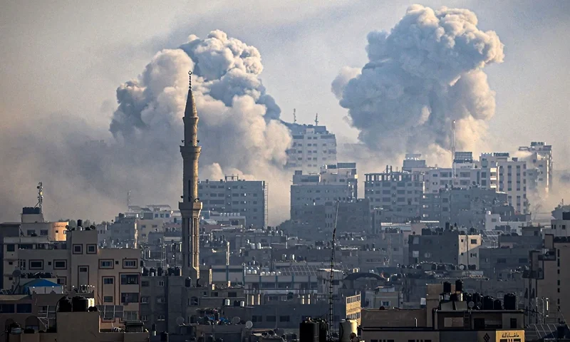 TOPSHOT - Smoke plumes billow during Israeli air strikes in Gaza City on October 12, 2023 as raging battles between Israel and the Hamas movement continue for the sixth consecutive day. Washington urged Israel to show restraint in its response to Hamas's surprise attack -- the worst in the country's 75-year history -- which Israeli forces said killed more than 1,200 people, mostly civilians. In Gaza, officials have reported more than 1,200 people killed in Israel's uninterrupted campaign of air and artillery strikes, while the UN said more than 338,000 people have been displaced. (Photo by IBRAHIM HAMS / AFP) (Photo by IBRAHIM HAMS/AFP via Getty Images)