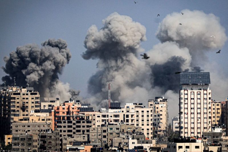 Smoke plumes billow during Israeli air strikes in Gaza City on October 12, 2023 as raging battles between Israel and the Hamas movement continue for the sixth consecutive day. Thousands of people, both Israeli and Palestinians have died since October 7, 2023, after Palestinian Hamas militants based in the Gaza Strip, entered southern Israel in a surprise attack leading Israel to declare war on Hamas in Gaza on October 8. (Photo by Mahmud HAMS / AFP) (Photo by MAHMUD HAMS/AFP via Getty Images)