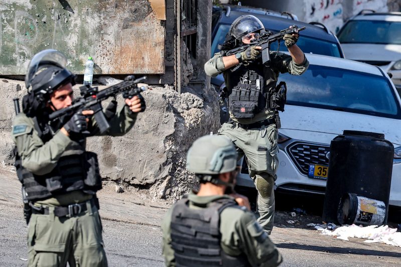 PALESTINIAN-ISRAEL-CONFLICT-PROTEST
Israeli security forces take aim during clashes with Palestinian protesters in the Wadi Joz neighbourhood in Israeli-annexed east Jerusalem on October 13, 2023. AFP correspondents and a security official reported clashes after rallies in solidarity with war-battered Gaza in Ramallah, Nablus, Tulkarm, Hebron and other cities and towns, with the Palestinian Red Crescent reporting dozens wounded across the West Bank, some critically. (Photo by AHMAD GHARABLI / AFP) (Photo by AHMAD GHARABLI/AFP via Getty Images)