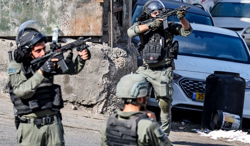PALESTINIAN-ISRAEL-CONFLICT-PROTEST Israeli security forces take aim during clashes with Palestinian protesters in the Wadi Joz neighbourhood in Israeli-annexed east Jerusalem on October 13, 2023. AFP correspondents and a security official reported clashes after rallies in solidarity with war-battered Gaza in Ramallah, Nablus, Tulkarm, Hebron and other cities and towns, with the Palestinian Red Crescent reporting dozens wounded across the West Bank, some critically. (Photo by AHMAD GHARABLI / AFP) (Photo by AHMAD GHARABLI/AFP via Getty Images)