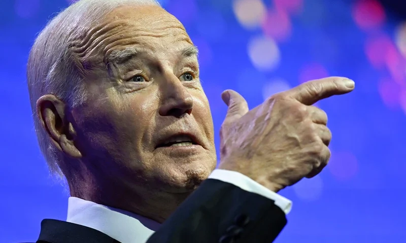 US-POLITICS-BIDEN US President Joe Biden mimics holding a firearm while speaking about assault weapon ban during the Human Rights Campaign National Dinner at the Washington Convention Center in Washington, DC, on October 14, 2023. (Photo by ANDREW CABALLERO-REYNOLDS / AFP) (Photo by ANDREW CABALLERO-REYNOLDS/AFP via Getty Images)