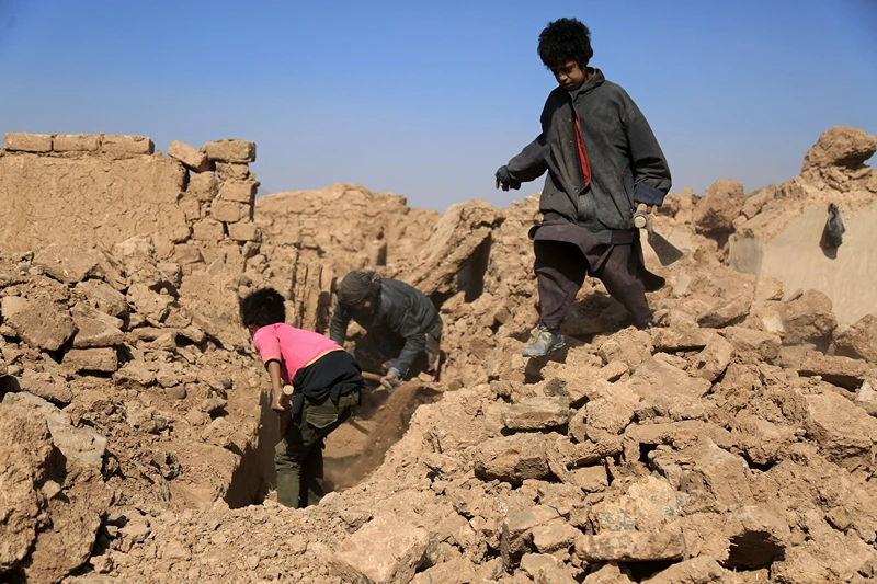 AFGHANISTAN-QUAKE
Afghan residents clear the debris of houses that were damaged in a series of earthquakes, in Injil district of Herat province on October 15, 2023. A magnitude 6.3 earthquake killed two people in western Afghanistan on October 15, with damaged prisons emptied and residents fleeing a region where tremors have claimed at least 1,000 lives this past week. (Photo by Mohsen KARIMI / AFP) (Photo by MOHSEN KARIMI/AFP via Getty Images)