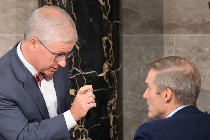Speaker Pro Tempore Rep. Patrick McHenry (R-NC) who presides over the vote for Speaker of the House in the House of Representatives, speaks with Rep. Jim Jordan (R-OH) inside the House Chamber at the US Capitol in Washington, DC, on October 18, 2023. US lawmakers rejected hard-line conservative Jim Jordan's bid for speaker of the House of Representatives in the first round of voting October 17, 2023, entrenching a stalemate that has paralyzed Washington for two weeks. (Photo by Mandel NGAN / AFP) (Photo by MANDEL NGAN/AFP via Getty Images)
