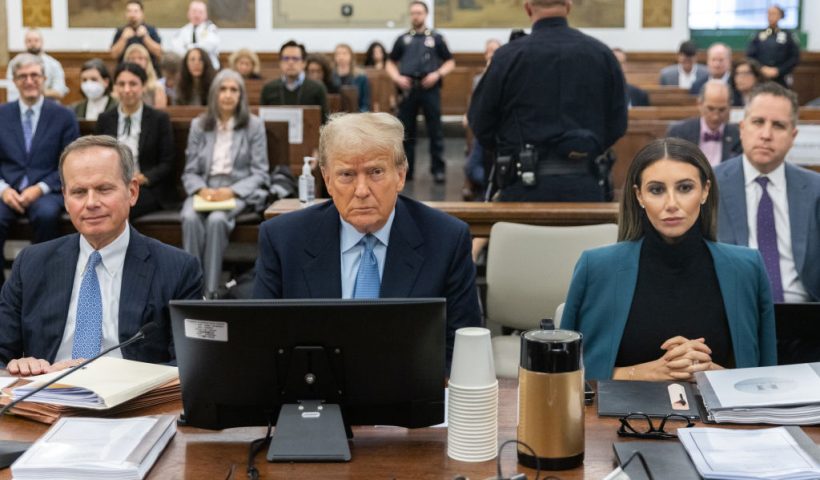 NEW YORK, NEW YORK - OCTOBER 18: Former President Donald Trump sits in the courtroom with attorneys Christopher Kise and Alina Habba during his civil fraud trial at New York State Supreme Court on October 18, 2023 in New York City. Trump may be forced to sell off his properties after Justice Arthur Engoron canceled his business certificates after ruling that he committed fraud for years while building his real estate empire after being sued by Attorney General Letitia James, who is seeking $250 million in damages. The trial will determine how much he and his companies will be penalized for the fraud. (Photo by Jeenah Moon-Pool/Getty Images)