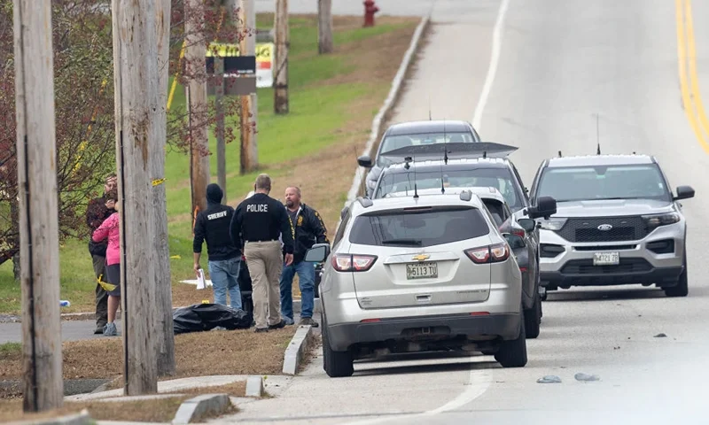 LEWISTON, MAINE - OCTOBER 26: Law enforcement officials investigate outside the site of a mass shooting at Schemengees Bar and Grille on October 26, 2023 in Lewiston, Maine. Police are still searching for the suspect in the shooting, Robert Card, who allegedly killed 18 people in two separate locations on Wednesday night. (Photo by Scott Eisen/Getty Images)