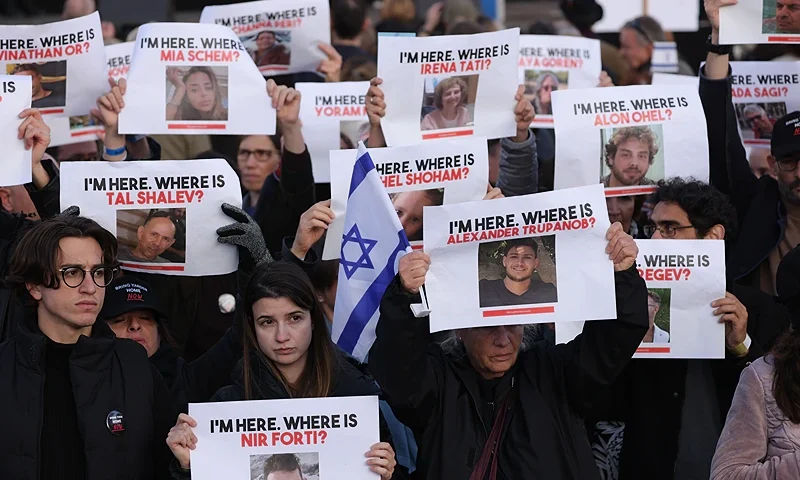 BERLIN, GERMANY - OCTOBER 22: People attending a demonstration to show solidarity with Israel and against anti-semitism hold up photographs of hostages taken by Hamas on October 22, 2023 in Berlin, Germany. Thousands of people attended the event in front of the Brandenburg Gate as the conflict between Hamas and Israel continues to range following the deadly October 7 incursions by Hamas fighters from Gaza into Israel. (Photo by Sean Gallup/Getty Images)