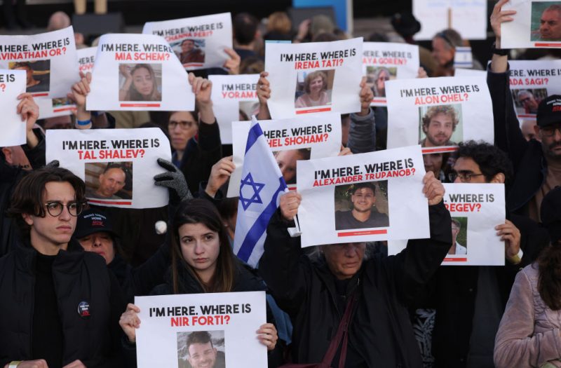 BERLIN, GERMANY - OCTOBER 22: People attending a demonstration to show solidarity with Israel and against anti-semitism hold up photographs of hostages taken by Hamas on October 22, 2023 in Berlin, Germany. Thousands of people attended the event in front of the Brandenburg Gate as the conflict between Hamas and Israel continues to range following the deadly October 7 incursions by Hamas fighters from Gaza into Israel. (Photo by Sean Gallup/Getty Images)