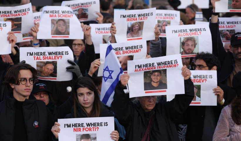 BERLIN, GERMANY - OCTOBER 22: People attending a demonstration to show solidarity with Israel and against anti-semitism hold up photographs of hostages taken by Hamas on October 22, 2023 in Berlin, Germany. Thousands of people attended the event in front of the Brandenburg Gate as the conflict between Hamas and Israel continues to range following the deadly October 7 incursions by Hamas fighters from Gaza into Israel. (Photo by Sean Gallup/Getty Images)