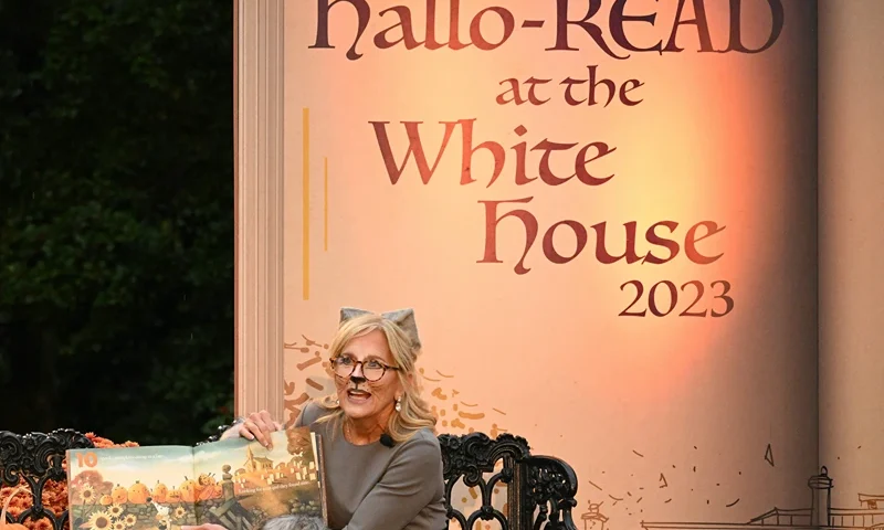 US-POLITICS-BIDEN-HALLOWEEN US First Lady Jill Biden, dressed a Willow the cat, reads books to children during a Halloween celebration on the South Lawn of the White House in Washington, DC, on October 30, 2023. (Photo by Mandel NGAN / AFP) (Photo by MANDEL NGAN/AFP via Getty Images)