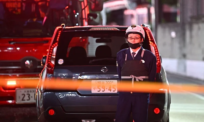 JAPAN-CRIME Police officers guard the area around a post office where a suspected gunman has taken an unknown number of people hostage in Warabi city, Saitama prefecture on October 31, 2023. (Photo by Philip FONG / AFP) / "The erroneous mention[s] appearing in the metadata of this photo by Philip FONG has been modified in AFP systems in the following manner: [Credit to AFP] instead of [JIJI Press and Japan out]. Please immediately remove the erroneous mention[s] from all your online services and delete it (them) from your servers. If you have been authorized by AFP to distribute it (them) to third parties, please ensure that the same actions are carried out by them. Failure to promptly comply with these instructions will entail liability on your part for any continued or post notification usage. Therefore we thank you very much for all your attention and prompt action. We are sorry for the inconvenience this notification may cause and remain at your disposal for any further information you may require." (Photo by PHILIP FONG/AFP via Getty Images)