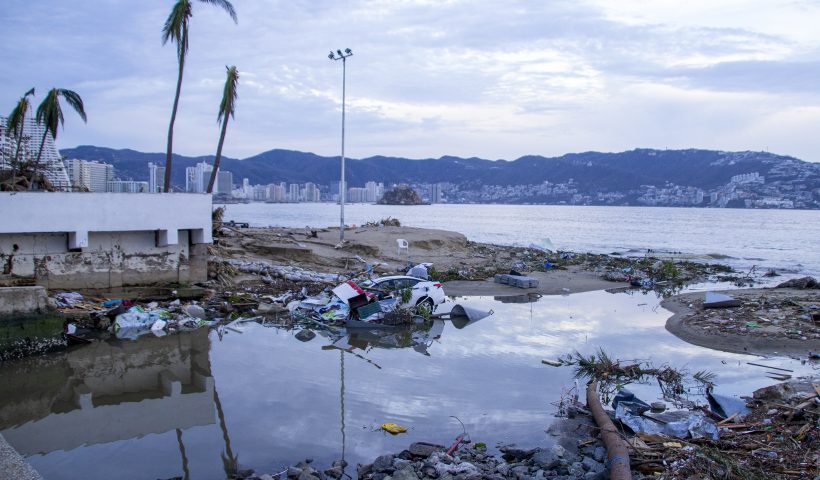 ACAPULCO, MEXICO - OCTOBER 25: A car is seen sunk after hurricane Otis hit Acapulco on October 25, 2023 in Acapulco, Mexico. Otis made landfall through the coast of Acapulco around midnight of October 25 as a category 5 storm. President Lopez Obrador reported that communications were interrupted in the city, power lines were down affecting almost a million people, infrastructure is severely damaged and the roads to the port present important damages. Hurricane Otis degraded to category 2 after reaching land. (Photo by Oscar Guerrero Ramirez/Getty Images)