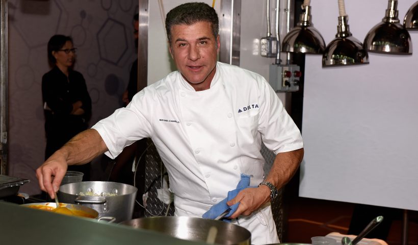 NEW YORK, NY - OCTOBER 16: Chef Michael Chiarello prepares food at Delta Presents Food with Altitude featuring Michael Chiarello, Michelle Bernstein, Linton Hopkins, Andrea Robinson and Jean-Paul Bourgeois during the Food Network New York City Wine & Food Festival Presented By FOOD & WINE at Union Square Events Kitchen on October 16, 2014 in New York City. (Photo by Dave Kotinsky/Getty Images for NYCWFF)