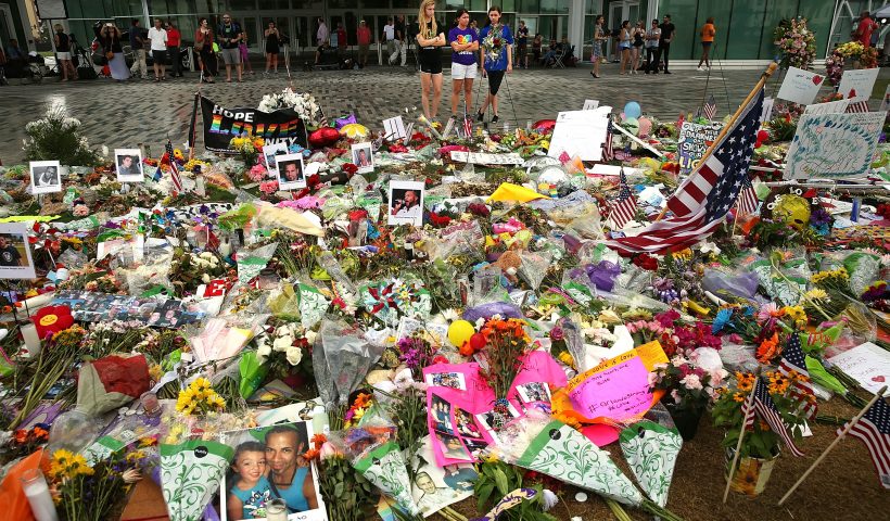ORLANDO, FL - JUNE 19: People visit a memorial down the road from the Pulse nightclub on June 19, 2016 in Orlando, Florida. In what is being called the worst mass shooting in American history, Omar Mir Seddique Mateen killed 49 people at the popular gay nightclub early last Sunday. Fifty-three people were wounded in the attack which authorities and community leaders are still trying to come to terms with. (Photo by Spencer Platt/Getty Images)