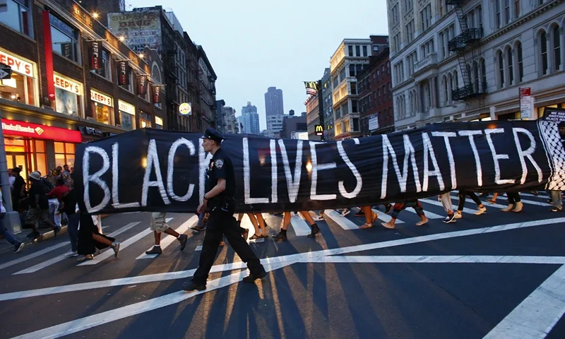 TOPSHOT - A police officer patrols during a protest in support of the Black lives matter movement in New York on July 09, 2016. The gunman behind a sniper-style attack in Dallas was an Army veteran and loner driven to exact revenge on white officers after the recent deaths of two black men at the hands of police, authorities have said. Micah Johnson, 25, had no criminal history, Dallas police said in a statement. (Photo by KENA BETANCUR / AFP) (Photo by KENA BETANCUR/AFP via Getty Images)