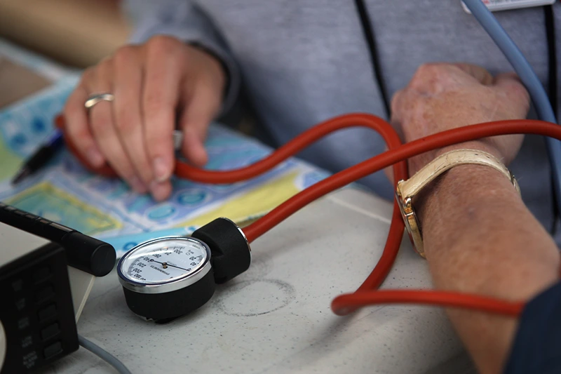 Largest Free Healthcare Clinic In Nation Treats Uninsured In Appalachia
WISE, VA - JULY 25: A nurse checks a patient's blood pressure at the Remote Area Medical (RAM), healthcare clinic July 25, 2008 in Wise, Virginia. The free weekend clinic, staffed by more than 1,400 vollunteer dentists, doctors and medical personel, is the largest of its kind in the nation and organizers expect more than 2,500 patients to turn out for the 2 1/2 day event. Residents of the area, most from the "coal counties" of Appalachia, come from one of the poorest and least educated areas in the United States. Most are underinsured or have no healthcare at all, and for many the annual RAM event is the only medical treatment they may get all year. Health insurance for the disadvantaged has become one of the main issues in this year's presidential race. (Photo by John Moore/Getty Images)