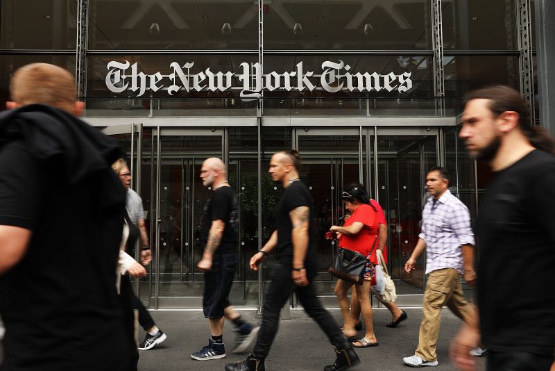 NEW YORK, NY - JULY 27: People walk past the New York Times building on July 27, 2017 in New York City. The New York Times Company shares have surged to a nine-year high after posting strong earnings on Thursday. Partly due to new digital subscriptions following the election of Donald Trump as president, the company reported a profit of $27.7 million in the second quarter, up from $9.1 million in the same period last year. (Photo by Spencer Platt/Getty Images)