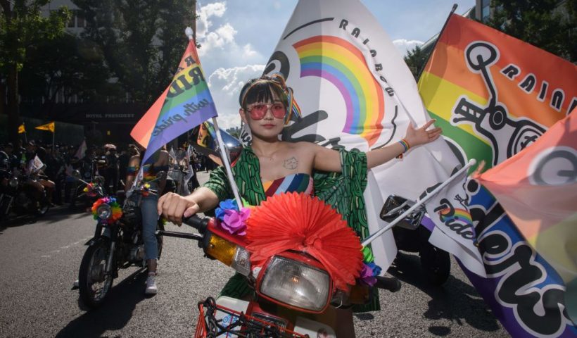 A participant of the Seoul Queer Parade waits on a motorcycle for the start of the parade on a street in Seoul on July 14, 2018. - Tens of thousands of members of the LGBT community and gay rights supporters paraded through Seoul's city centre on July 14 as conservatives protested loudly at what they called "obscenity". (Photo by Ed JONES / AFP) (Photo credit should read ED JONES/AFP via Getty Images)