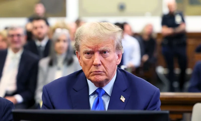 NEW YORK, NEW YORK - OCTOBER 02: Former U.S. President Donald Trump appears in the courtroom with his lawyers for the start of his civil fraud trial at New York State Supreme Court on October 02, 2023 in New York City. Former President Trump may be forced to sell off his properties after Justice Arthur Engoron canceled his business certificates and ruled that he committed fraud for years while building his real estate empire after being sued by Attorney General Letitia James, who is seeking $250 million in damages. The trial will determine how much he and his companies will be penalized for the fraud. (Photo by Brendan McDermid-Pool/Getty Images)