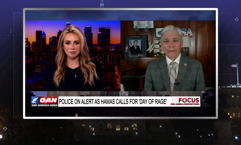 Video still from In Focus on One America News Network showing a split screen of the host on the left side, and on the right side is the guest, Steven Rodgers.