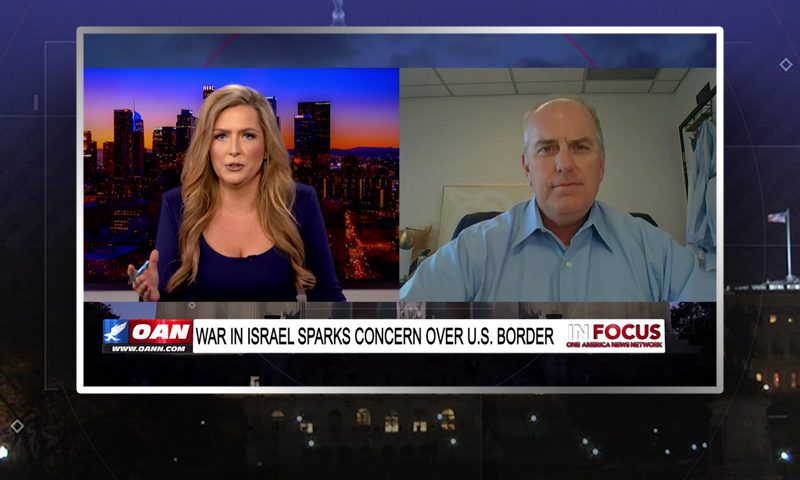 Video still from In Focus on One America News Network showing a split screen of the host on the left side, and on the right side is the guest, Colin Schmitt.