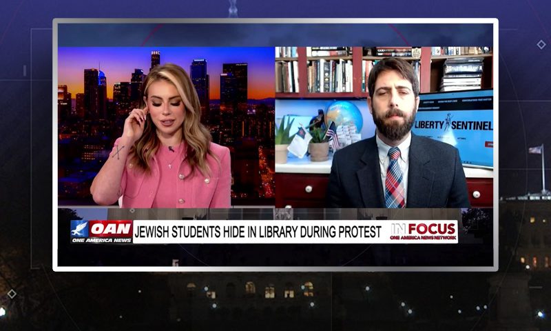 Video still from In Focus on One America News Network showing a split screen of the host on the left side, and on the right side is the guest, Alex Newman.