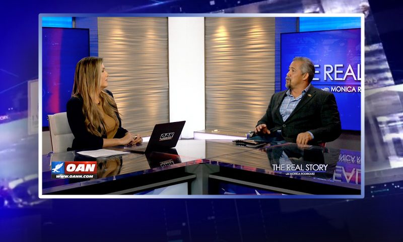 Video still from Will Spencer's interview with The Real Story on One America News Network