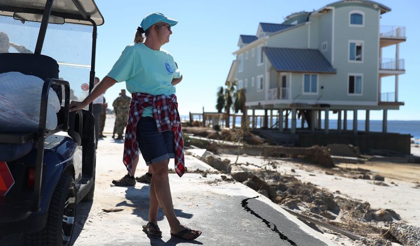 MEXICO BEACH, FL - OCTOBER 12: Angel Smith stands next to a golf cart with some of the items she salvaged from her home that was damaged by Hurricane Michael on October 12, 2018 in Mexico Beach, Florida. Angel said, ' she never thought she would one day have all her belongings in two plastic bags'. The hurricane hit the panhandle area with category 4 winds causing major damage. (Photo by Joe Raedle/Getty Images)