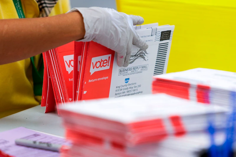 US-POLITICS-VOTE
An election worker opens envelopes containing vote-by-mail ballots for the August 4 Washington state primary at King County Elections in Renton, Washington on August 3, 2020. (Photo by Jason Redmond / AFP) (Photo by JASON REDMOND/AFP via Getty Images)