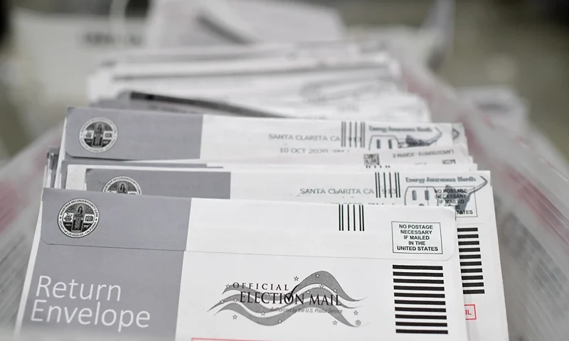 Mail-in ballots in their envelopes await processing at the Los Angeles County Registrar Recorders' mail-in ballot processing center at the Pomona Fairplex in Pomona, California, October 28, 2020. - Officials relocated mail-in ballot processing to the expansive location due to the need for COVID-19 social distancing for the ballot workers and the large number of mail-in ballots. While the tabulation of votes cast for Donald Trump and Joe Biden will begin when polls close on November 3 at 8pm, envelopes are now being sorted and signatures and ballots verified to expedite the tabulation process on November 3. (Photo by Robyn Beck / AFP) (Photo by ROBYN BECK/AFP via Getty Images)