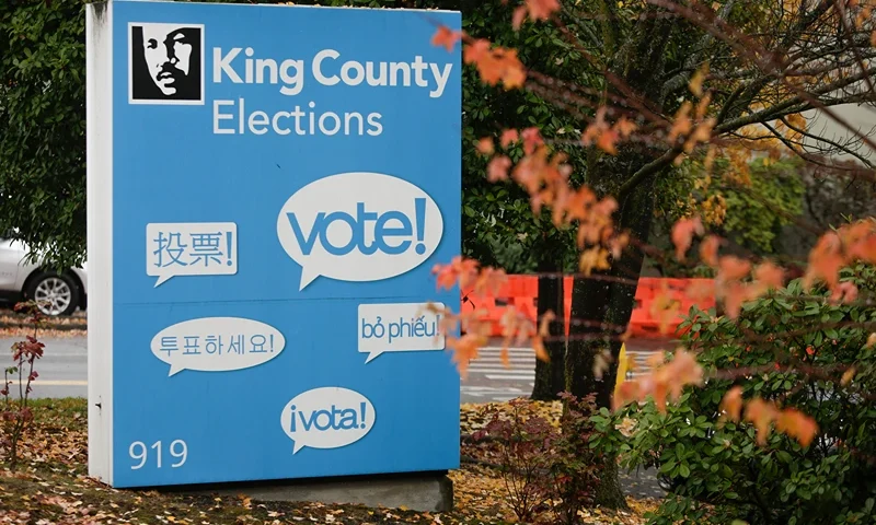 US-VOTE-WASHINGTON The word "vote!" is translated into different languages on a sign at the King County Elections office on Election Day in Renton, Washington on November 3, 2020. - Americans were voting on Tuesday under the shadow of a surging coronavirus pandemic to decide whether to reelect Republican Donald Trump, one of the most polarizing presidents in US history, or send Democrat Joe Biden to the White House. (Photo by Jason Redmond / AFP) (Photo by JASON REDMOND/AFP via Getty Images)