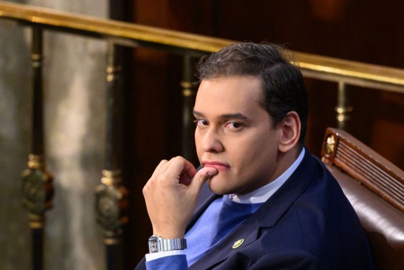 TOPSHOT - Newly elected Republican Representative from New York, George Santos looks on as the US House of Representatives convenes for the 118th Congress at the US Capitol in Washington, DC, January 3, 2023. - The new US Congress was thrown into chaos on its first day Tuesday as rebel right-wing Republicans moved to block party favorite Kevin McCarthy from becoming speaker of the House of Representatives. (Photo by Mandel NGAN / AFP) (Photo by MANDEL NGAN/AFP via Getty Images)