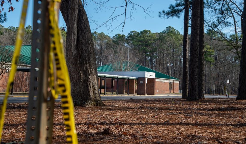 NEWPORT NEWS, VA - JANUARY 07: Police tape hangs from a sign post outside Richneck Elementary School following a shooting on January 7, 2023 in Newport News, Virginia. A 6-year-old student was taken into custody after reportedly shooting a teacher during an altercation in a classroom at Richneck Elementary School on Friday. The teacher, a woman in her 30s, suffered “life-threatening” injuries and remains in critical condition, according to police reports. (Photo by Jay Paul/Getty Images)