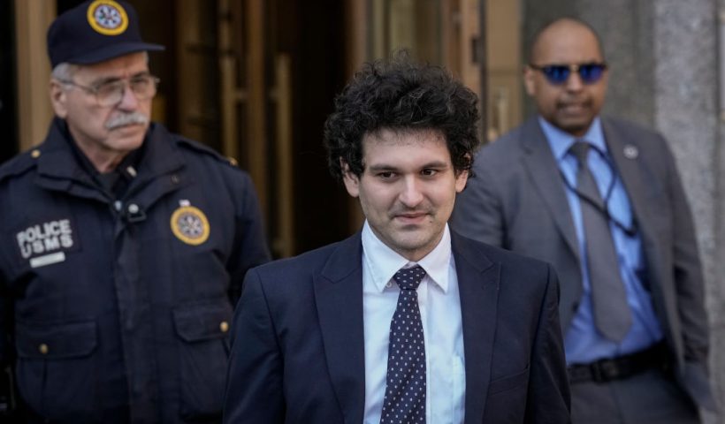 NEW YORK, NY - MARCH 30: FTX founder Sam Bankman-Fried (C) departs Manhattan Federal Court after an arraignment hearing on March 30, 2023 in New York City. Federal prosecutors added a foreign bribery charge to the list of crimes that Bankman-Fried is already facing. The indictment accuses the FTX founder of directing $40 million in bribes to Chinese government officials to unfreeze assets related to his cryptocurrency business. (Photo by Drew Angerer/Getty Images)