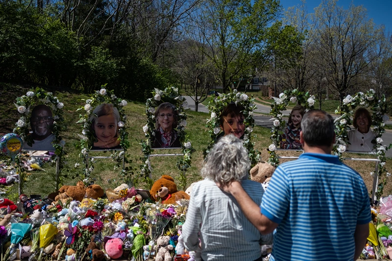 NASHVILLE, TN - APRIL 01: People visit a makeshift memorial at the entrance of The Covenant School on April 1, 2023 in Nashville, Tennessee. Three students and three adults were killed by the 28-year-old shooter on Monday. (Photo by Seth Herald/Getty Images)