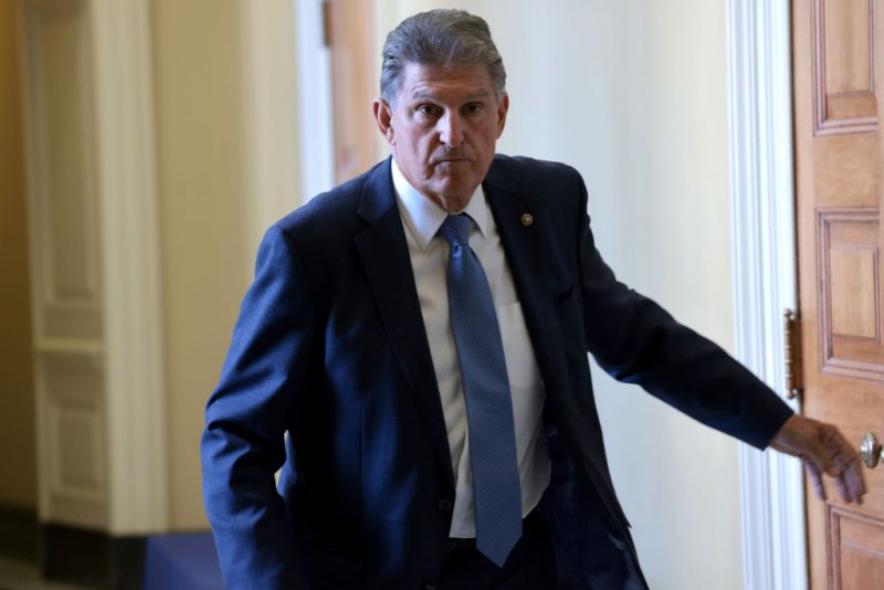 WASHINGTON, DC - OCTOBER 07: Sen. Joe Manchin (D-WV) leaves a Democratic luncheon at the U.S. Capitol October 7, 2021 in Washington, DC. Senate Democrats and Republicans have reached a deal that will temporarily raise the debt ceiling through early December. (Photo by Win McNamee/Getty Images)