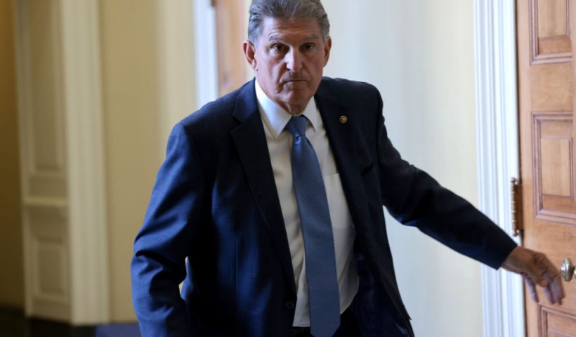 WASHINGTON, DC - OCTOBER 07: Sen. Joe Manchin (D-WV) leaves a Democratic luncheon at the U.S. Capitol October 7, 2021 in Washington, DC. Senate Democrats and Republicans have reached a deal that will temporarily raise the debt ceiling through early December. (Photo by Win McNamee/Getty Images)