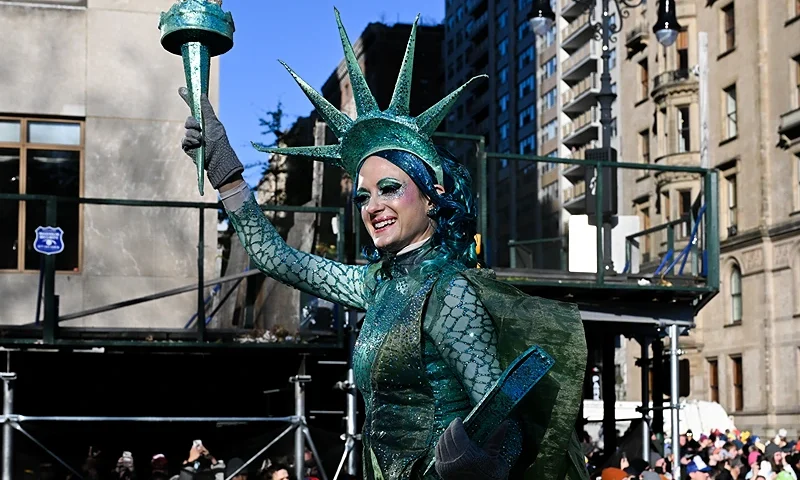 NEW YORK, NEW YORK - NOVEMBER 24: Revelers take part in the 96th-annual Macys Thanksgiving Day Parade on November 24, 2022 in New York City. The annual Macy’s parade includes 16 giant character balloons, 28 floats, and 12 marching bands. Organizers expected more than 2.5 million spectators to come out for it. (Photo by Alexi J. Rosenfeld/Getty Images)