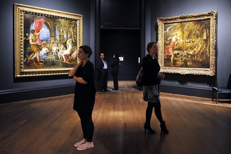 LONDON, ENGLAND - JULY 09: People admire Titian masterpieces in the 'Metamorphosis: Titian 2012' Exhibition at the National Gallery on July 9, 2012 in London, England. The 'Metamorphosis: Titian 2012' Exhibition, which includes work by contemporary artists inspired by the Titian masterpieces, will run from July 11, 2012 until September 23, 2012. (Photo by Bethany Clarke/Getty Images)