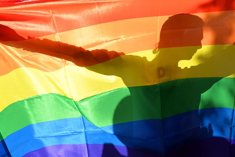 TOPSHOT-UKRAINE-SOCIAL-GAY-PARADE-PROTEST
TOPSHOT - An activist's silhouette is seen through a rainbow flag during a Gay Parade in Kiev on May 25, 2013. Around a hundred gay rights activists marched in Ukraine on Saturday despite fears of violence and a court ban, marking the first gay pride event in the ex-Soviet country, where homophobia is widespread and generally accepted. AFP PHOTO/ SERGEI SUPINSKY (Photo by Sergei SUPINSKY / AFP) (Photo by SERGEI SUPINSKY/AFP via Getty Images)