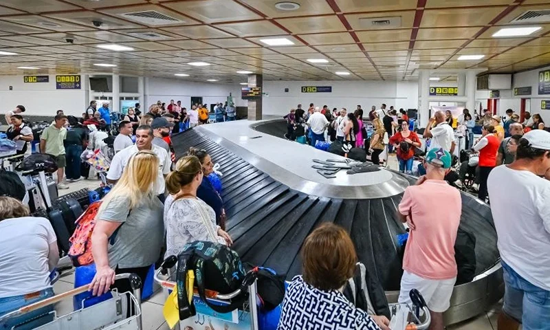 Passengers wait for their luggage at Havana's Jose Marti airport on October 12, 2023. (Photo by ADALBERTO ROQUE / AFP) (Photo by ADALBERTO ROQUE/AFP via Getty Images)