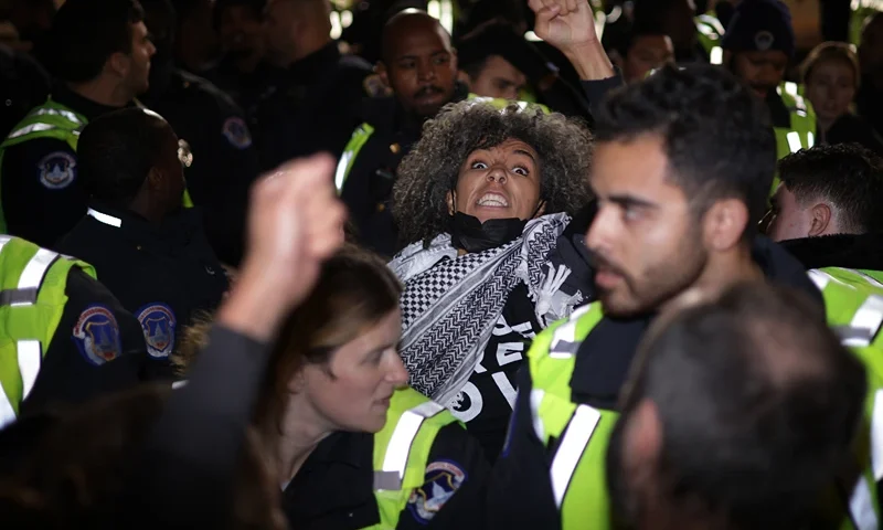 Jewish Peace Activists Rally Near Capitol Hill WASHINGTON, DC - NOVEMBER 15: Members of U.S. Capitol Police take a protester away from the headquarters of the Democratic National Committee during a demonstration against the war between Israel and Hamas on November 15, 2023 on Capitol Hill in Washington, DC. Jewish Voice for Peace and If Not Now held a candlelight vigil to call for a ceasefire in the Israel-Hamas war. (Photo by Alex Wong/Getty Images)