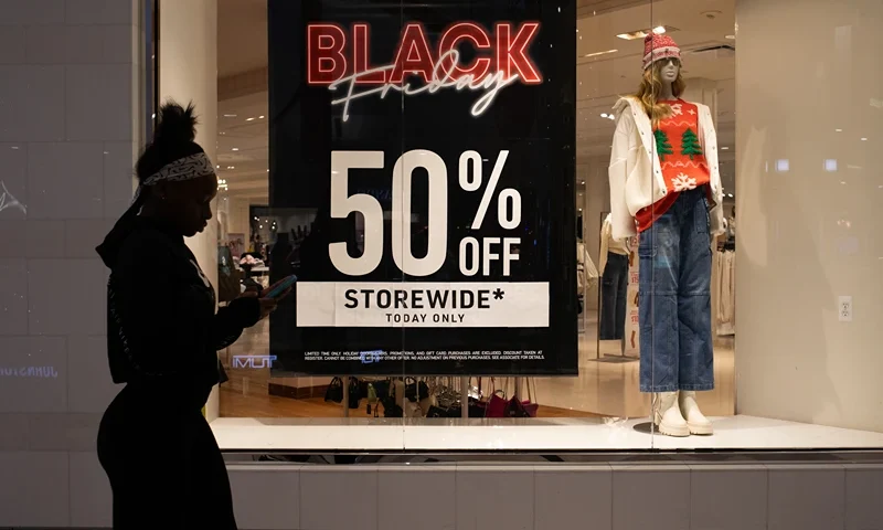 NOVI, MICHIGAN - NOVEMBER 24: A shopper walks around Twelve Oaks Mall on November 24, 2023 in Novi, Michigan. The National Retail Federation projects that an estimated 182 million are planning to shop in-store and online through the five-day Thanksgiving weekend. (Photo by Emily Elconin/Getty Images)