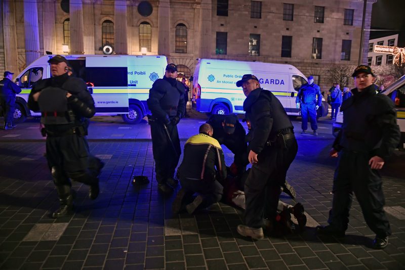 DUBLIN, IRELAND - NOVEMBER 24: Police officers patrol the city for a second night to counter violence and unrest sparked by school stabbings on November 24, 2023 in Dublin, Ireland. Vehicles were set alight and shops looted in Dublin last night, following a knife attack outside a school that left five people, including three children, injured. (Photo by Charles McQuillan/Getty Images)